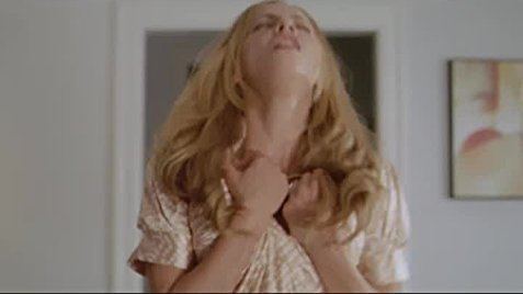 Bijou Phillips crumpling her blouse in a movie scene from the 2009 romantic comedy film Made for Each Other