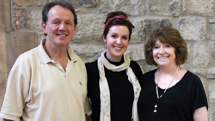 Kevin Whately and his wife Madelaine Newton smiling together with Kitty Whately