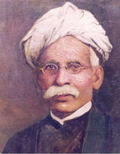 Madhusudan Das with mustache while wearing a white turban, eyeglasses, and black long sleeves