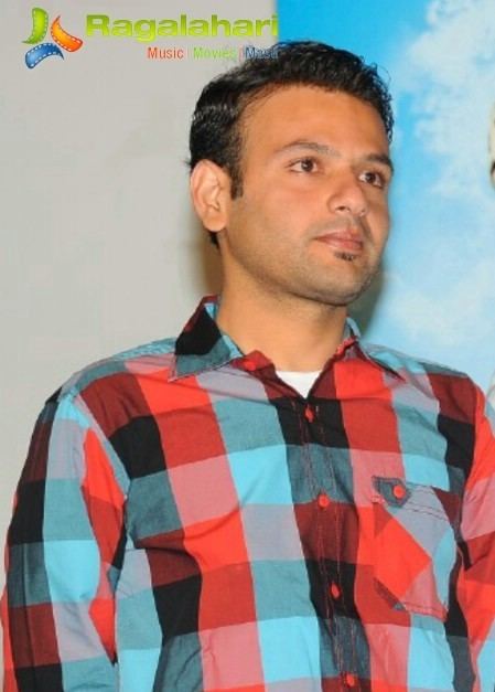 Maganti Ramji wearing a checkered shirt.