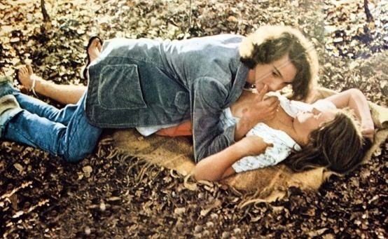 Lara Wendel and Martin Loeb lying on the ground in a scene from 1977 movie, Maladolescenza