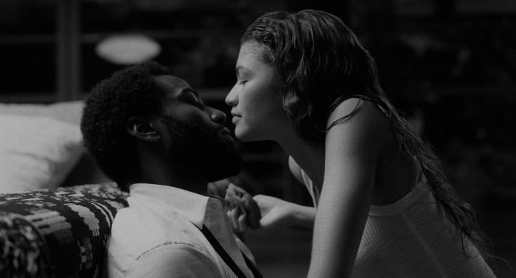 John David Washington and Zendaya's face close to each other in a romantic scene from the 2021 black-and-white romantic drama film, Malcolm & Marie