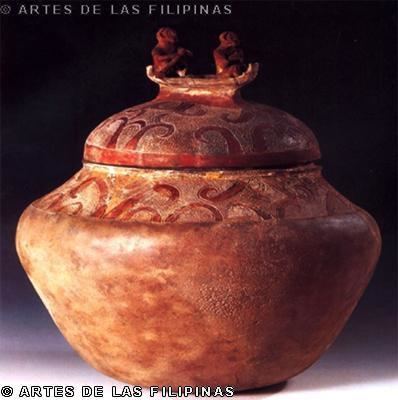A Manunggul Jar with two prominent figures at the top handle of its cover represents the journey of the soul to the afterlife.