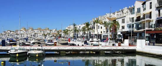 Beach In Puerto Banus, Marbella, Spain Marbella Is A Popular Holiday  Destination Located On The Costa Del Sol In The Southern Andalusia, It Lies  Beneath The Cordillera Penibetica Mountains Stock Photo, Picture
