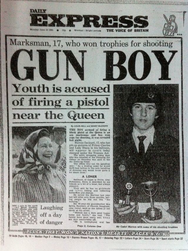 Daily Express cover of a 1981 newspaper states “Marksman, 17, who won trophies for shooting, Gun Boy, Youth is accused of firing a pistol near the queen.” On the right is Marcus Sarjeant seriously looking and holding some of his shooting trophies and wearing a hat and wearing a white polo with a black necktie under a black coat