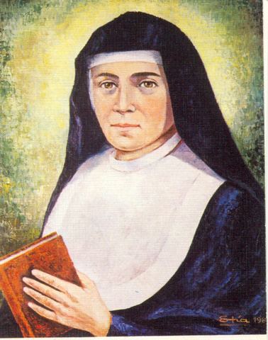 A painting of Maria Domenica Mazzarello smiling while holding a small book wearing a white head cover under a black nun veil, and a religious nun habit clothing
