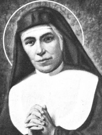 Maria Domenica Mazzarello praying in an old photograph, wearing a white head cover under a black nun veil, and a religious nun habit clothing