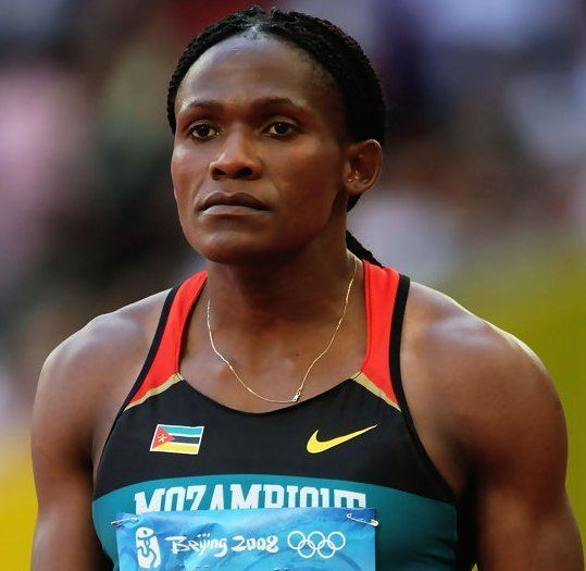 Maria Mutola, during her track and field competition, while wearing a black and orange top