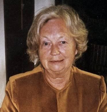 Maria Quisling wearing a brown long-sleeved shirt