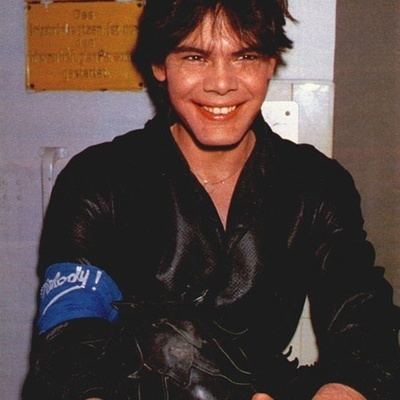 Marian Gold smiling and wearing black long sleeves.