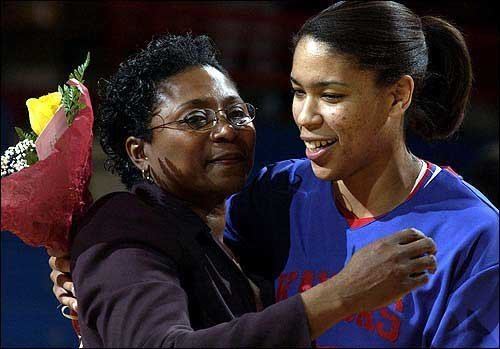 Marian Washington Photo Kansas womens basketball coach Marian Washington left hugs