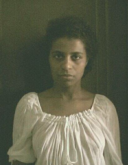 Marie-Joseph Angélique looking serious, wearing a white blouse