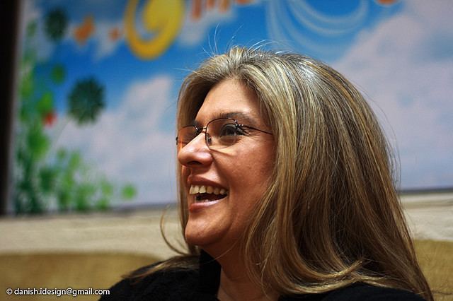 Marina Khan laughing while wearing eyeglasses