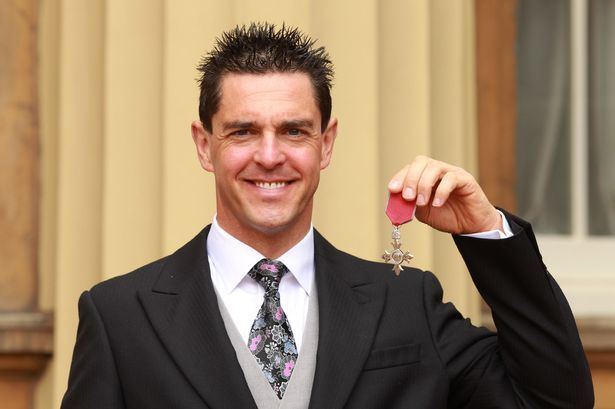 Mark Colbourne Welsh cyclist Mark Colbourne collects MBE at Buckingham