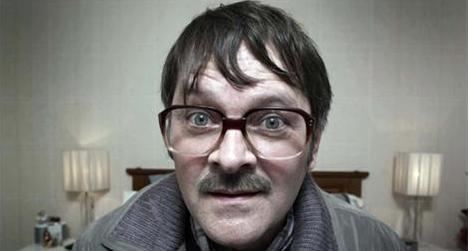 Mark Heap as James "Jim" Bell wearing eyeglasses with a mustache in Friday Night Dinner, a British television sitcom.