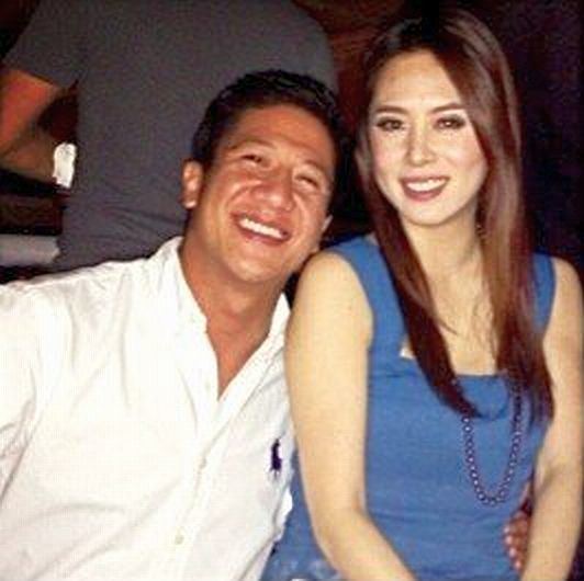 Grace Lee wearing a blue dress and necklace and Mark Leviste wearing a white long sleeves