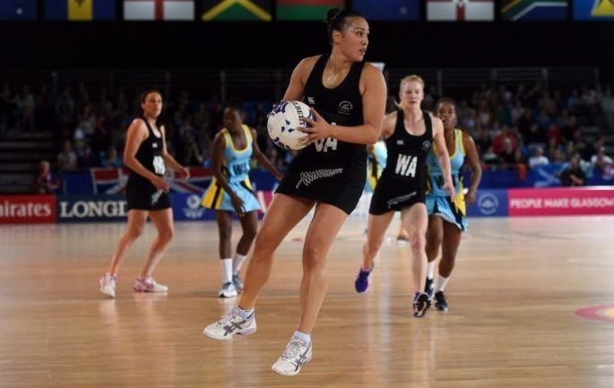 Marvadene Anderson playing netball while wearing a black jersey
