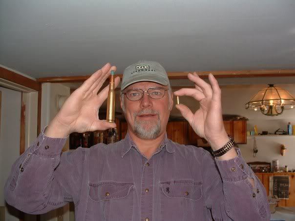 Marvin Heemeyer wearing violet long sleeves, gray cap and eyeglasses