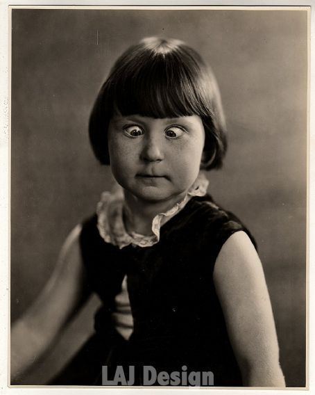 Mary Ann Jackson with a cross-eyed pose while wearing a sleeveless dress