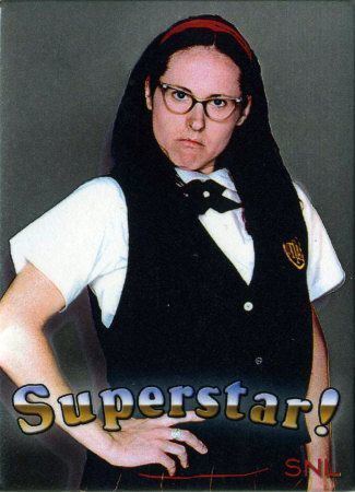 On the Superstar, Saturday night live is Mary Katherine Gallagher being serious, has black hair,  right hand on her waist, she is wearing eyeglass, white school uniform under a black vest with the school patch, a dark-blue bow tie, a red headband, and plaid skirt.