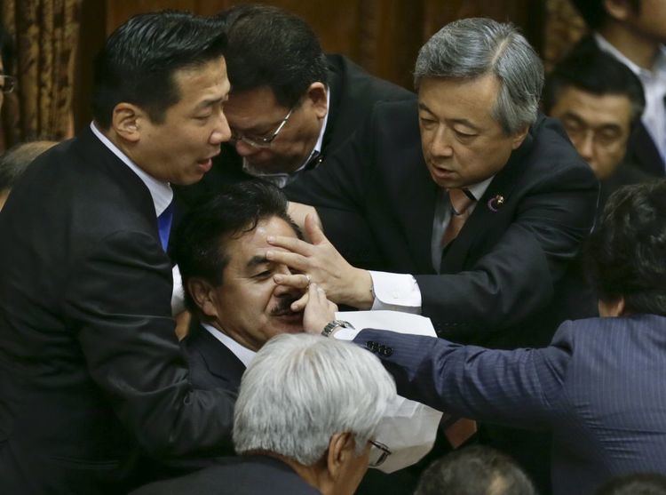 Masahisa Sato Photos Japan39s lawmakers have a fistfight over pacifism