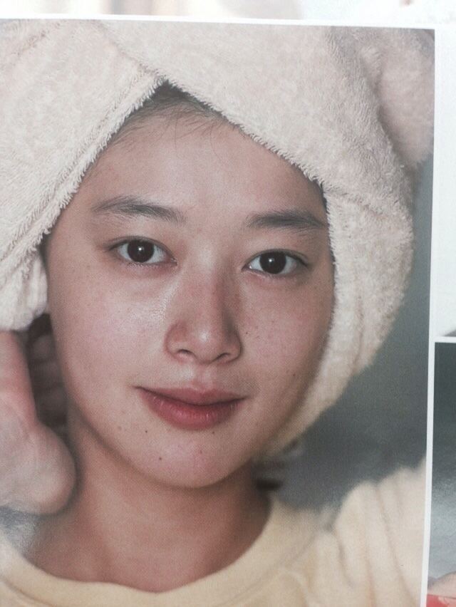 Masako Natsume with a towel on her head.