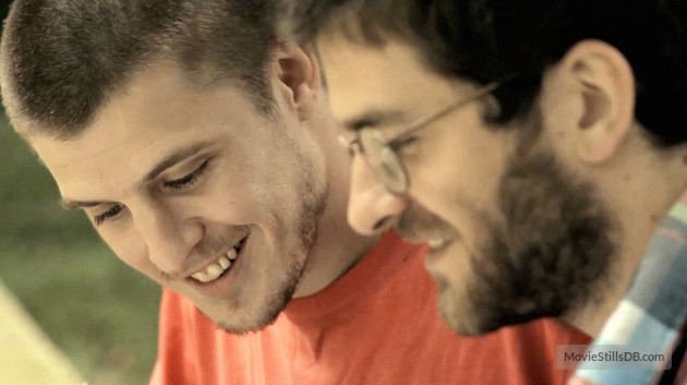 A movie scene from Hawaii (2013) starring Mateo Chiarino as Martín and Manuel Vignau as Eugenio smiling together