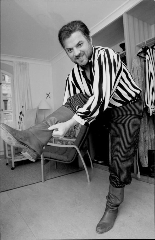 Mats Bergman Vintage photo of Actor Mats Bergman puts on the boots in front of