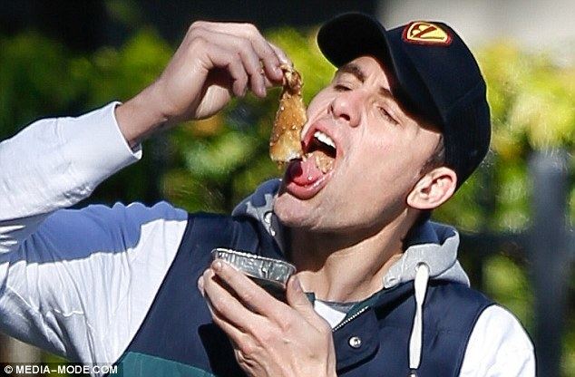 Matthew Richardson (footballer) Former AFL player Matthew Richardson shovels food into his mouth as