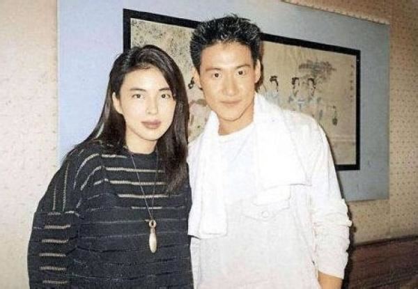 May Lo wearing a black dress while Jacky Cheung wearing a white long shirt with a towel on his shoulder.