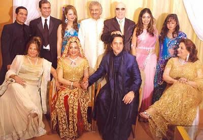 Fardeen Khan and his wife Natasha Madhvani sitting on the chair with their family