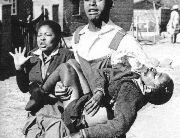 Hector Pieterson carried by Mbuyisa Makhubu after being shot by South African police. Peterson's sister, Antoinette runs beside them