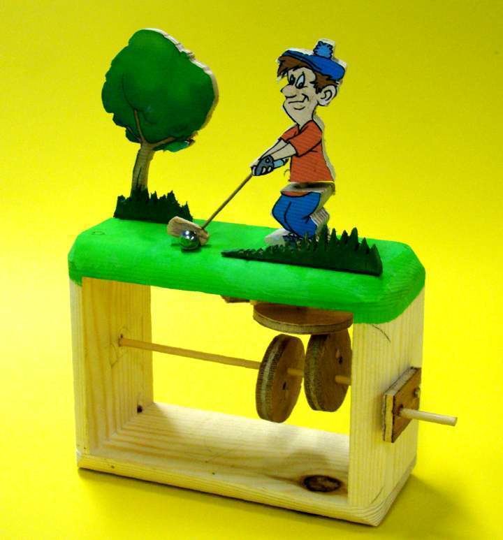 Mechanical toy of a man playing golf