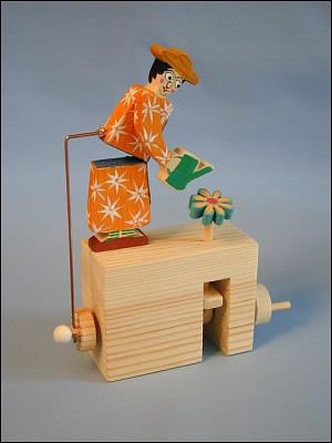 A woman watering a flower Mechanical toy