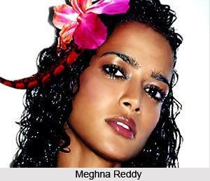 Meghna Reddy with a flower on her black curly hair