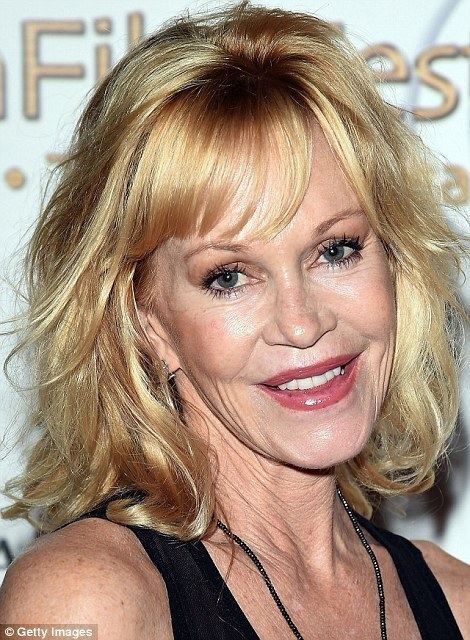 Melanie Griffith Melanie Griffith pictured with Lion family adopted from