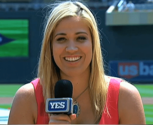 Meredith Marakovits wearing a pink sleeveless shirt while reporting on YES network