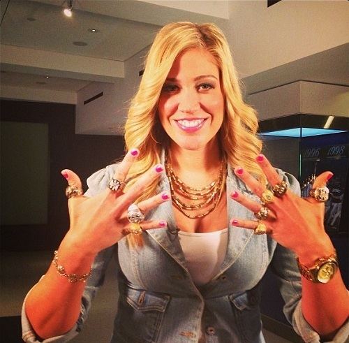 Meredith Marakovits wearing a denim jacket and a lot of jewelry