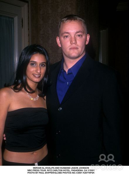 Meriam Al-Khalifa smiling and wearing a black tube top and necklace while Jason Johnson wearing a black coat and blue long sleeves