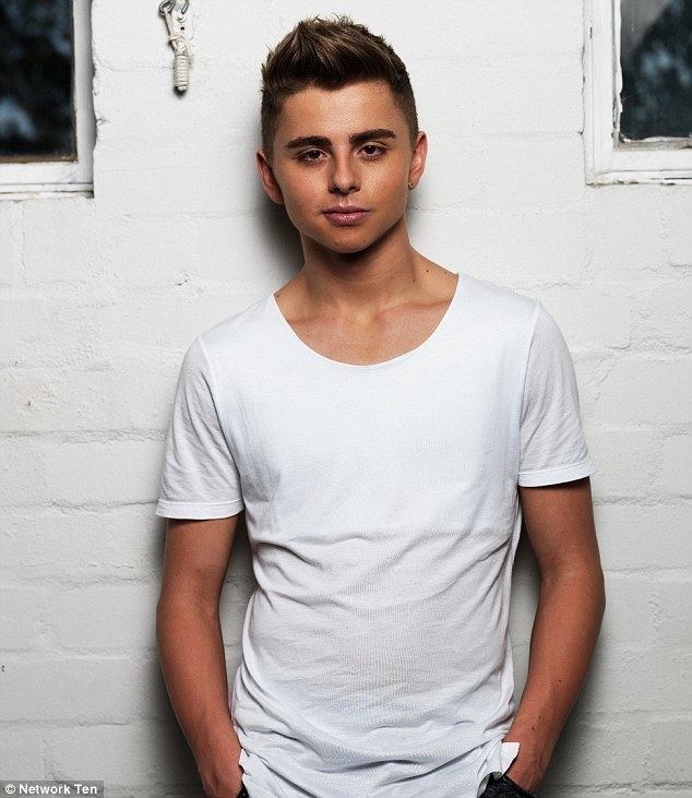 Michael Dameski's hands on his pocket while wearing a white t-shirt