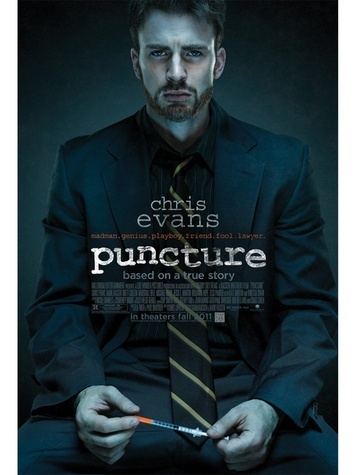 Chris Evans as Mike Weiss wearing a black coat, long sleeves, and necktie on a poster of the 2011 film, Puncture