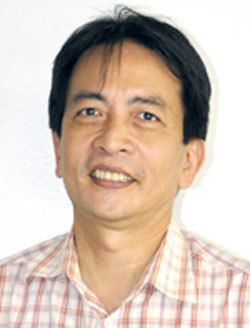 Smiling Michael Tan in white background