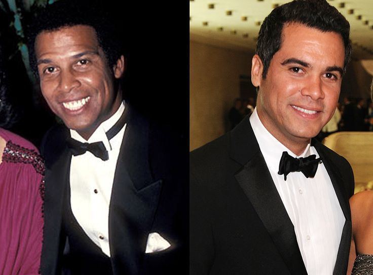 On the left is Michael Warren smiling and wearing a black coat, white long sleeves, and bow tie while on the right is Cash Warren