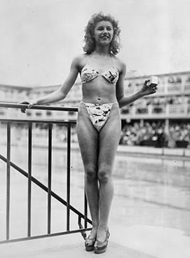 Micheline Bernardini wearing the World’s first bikini at the Molitor Pool in Paris (front view)