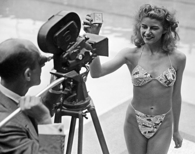 Micheline Bernardini in front of a videographer wearing the World’s first bikini