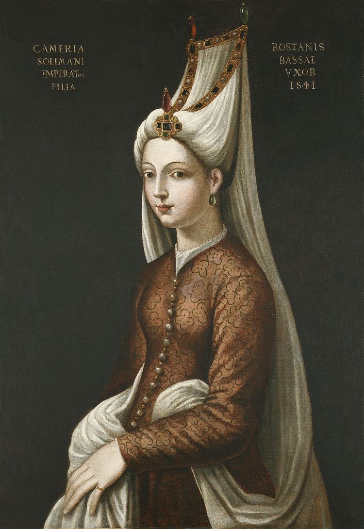 Portrait of Mihrimah Sultan wearing a plain brown gown with floral motifs and tall headdress ornate with expensive stones