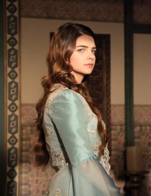 Pelin Karahan as Mihrimah Sultan wearing a sky blue and cream gown in a scene from the 2011 tv series, The Magnificent Century