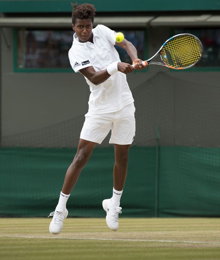 Mikael Ymer during a tennis competition wearing white sportswear