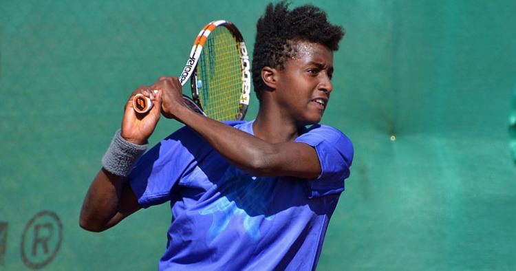 Mikael Ymer during a tennis competition wearing blue sportswear
