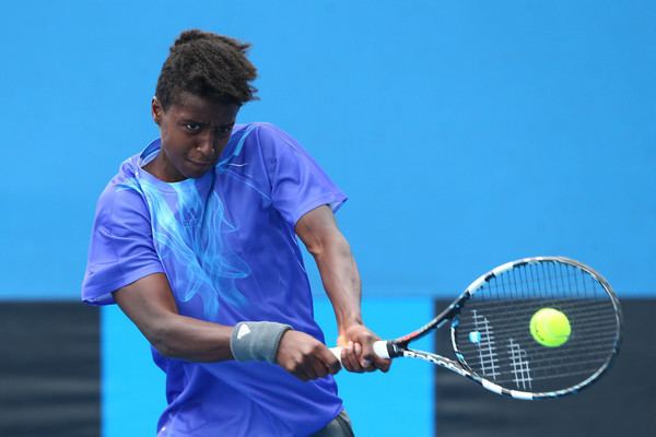 Mikael Ymer during a tennis competition wearing blue sportswear